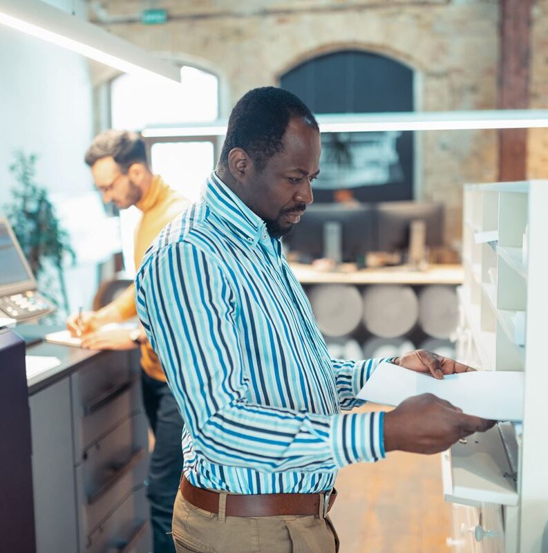 man printing documents